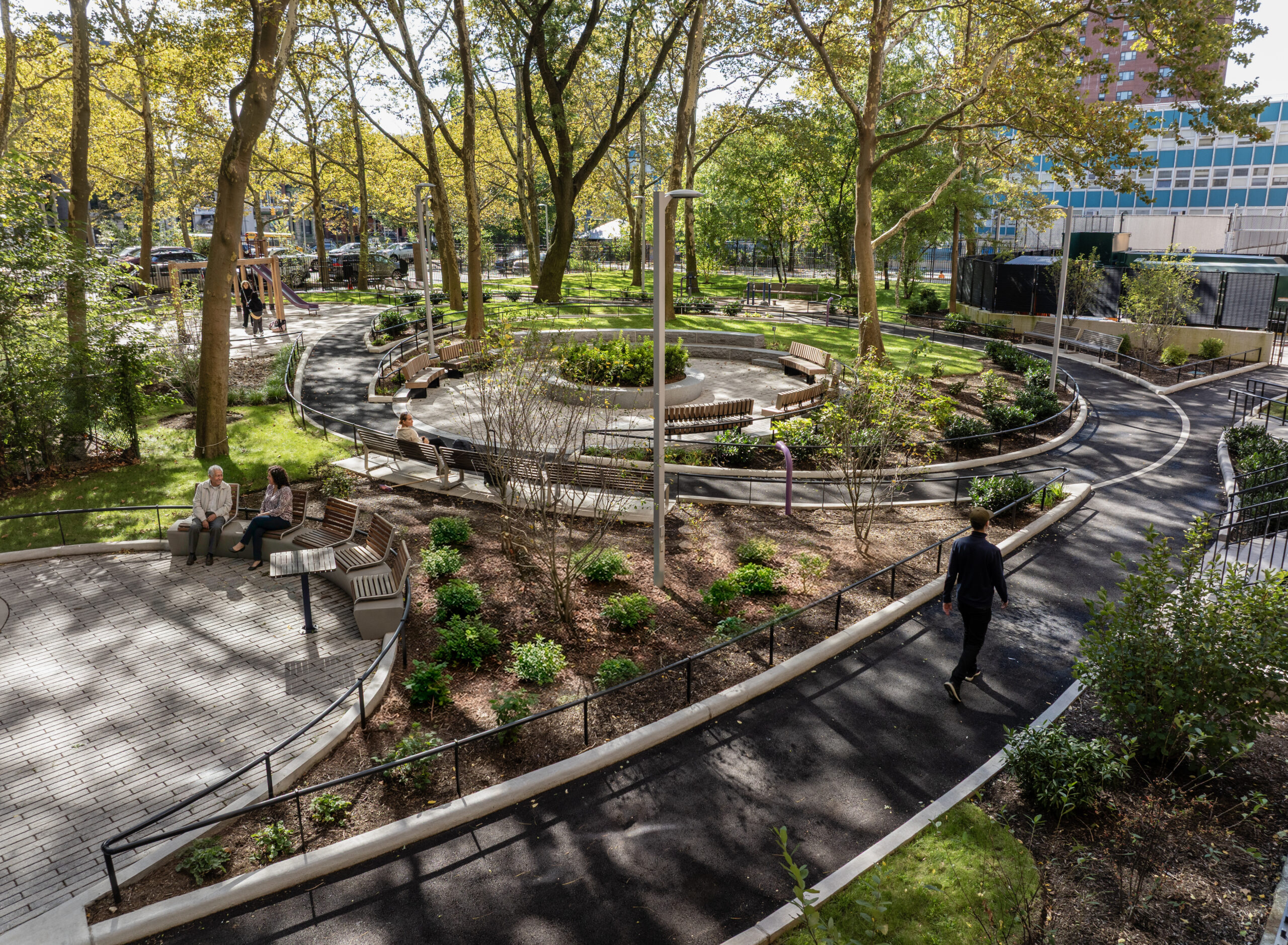 Bethune Gardens – Walking Paths and Gathering Spaces Curvilinear walking paths and community seating spaces at Bethune Gardens NYCHA landscape renovation in Washington Heights