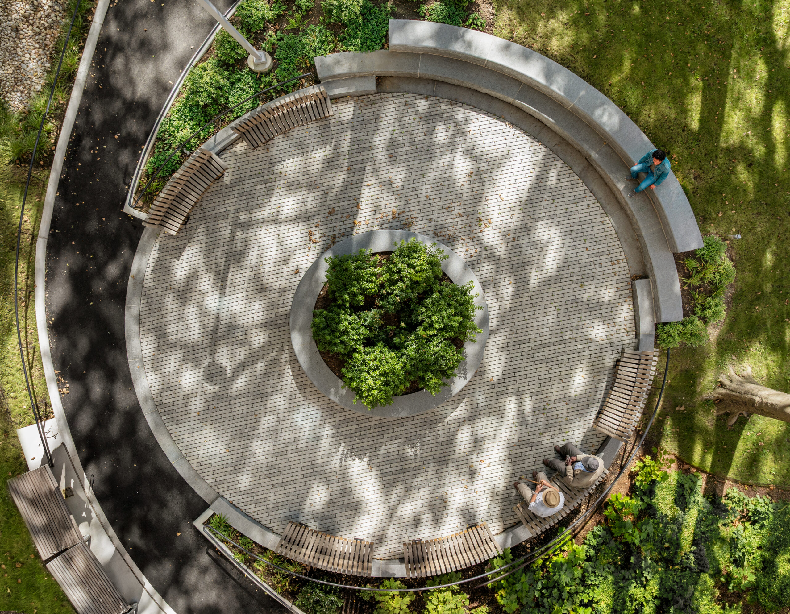 Bethune Gardens – Aerial Amphitheater View 1 Aerial view of the circular granite amphitheater and curvilinear pathways at Bethune Gardens NYCHA PACT landscape renovation in Washington Heights, Manhattan