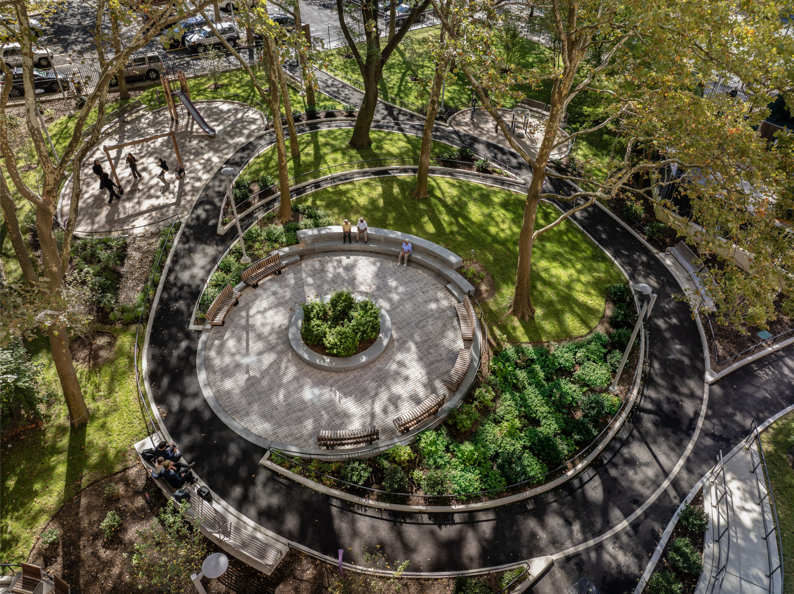 Bethune Gardens – Aerial Amphitheater View 2 Aerial view of the circular granite amphitheater and curvilinear pathways at Bethune Gardens NYCHA PACT landscape renovation in Washington Heights, Manhattan